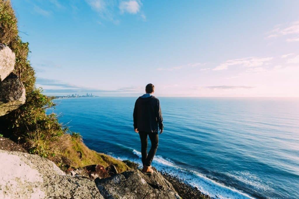 guy looking out into the vast blue ocean (blue ocean strategy)